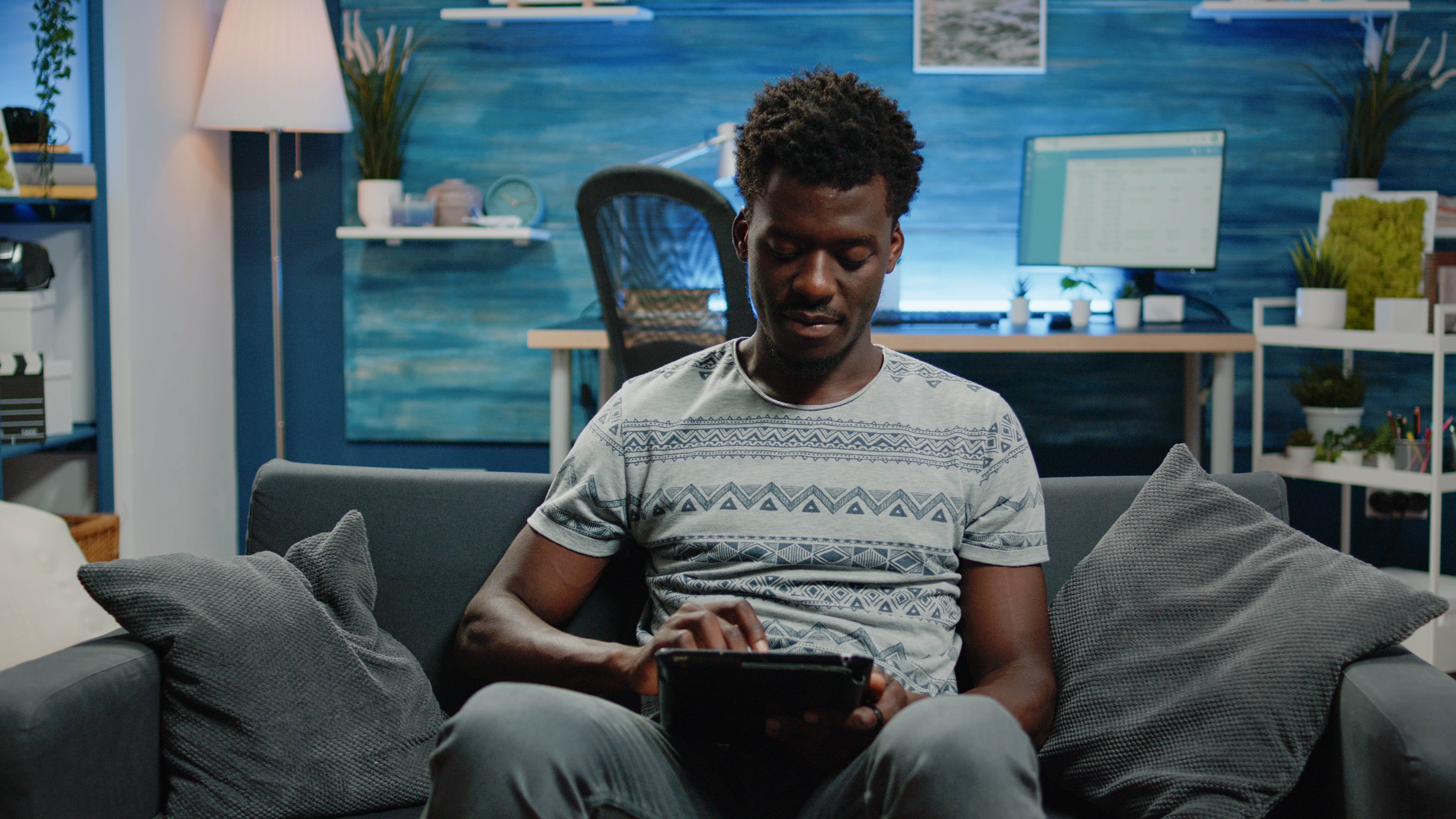 Young freelancer using digital tablet with touch screen for work